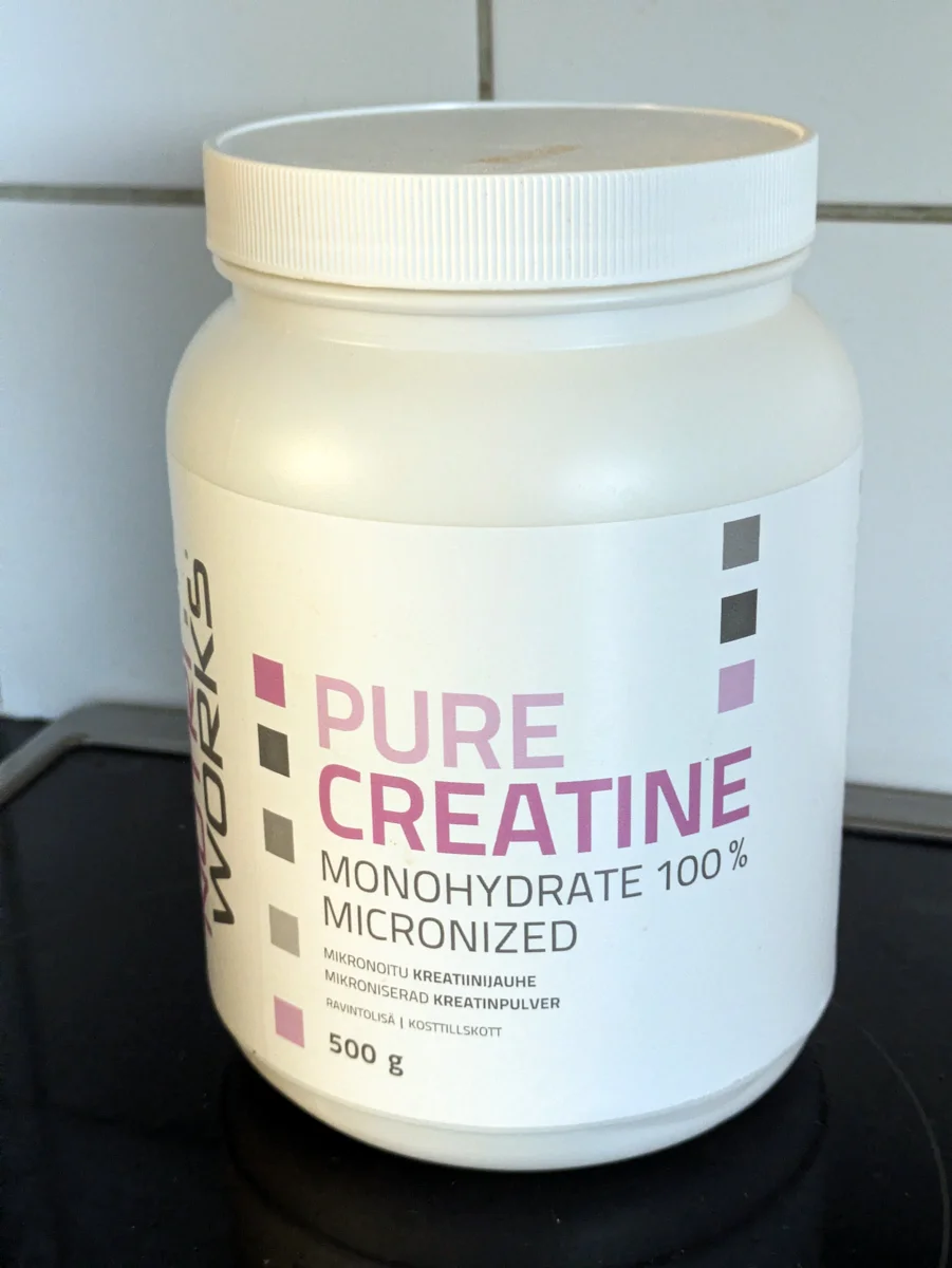 Creatine monohydrate powder scoop for gym workouts