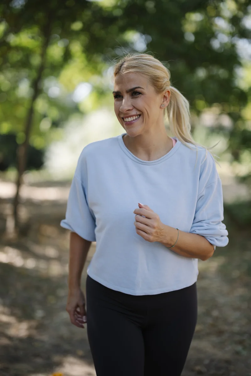 Person jogging and exercising outdoors in nature